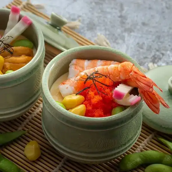 Prawn, fish roe and kamaboko in a celadon cup