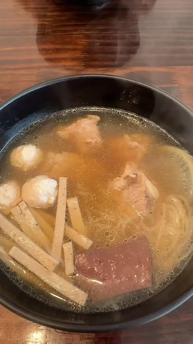 Kuay jap yuan with chicken balls, chicken sausage, blood and noodles in clear broth