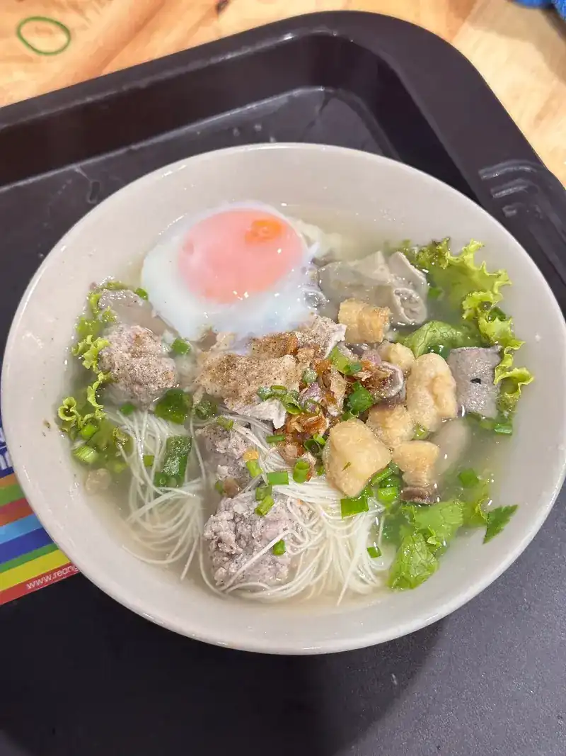 Thin noodles in clear soup with pork, meatballs and a soft egg