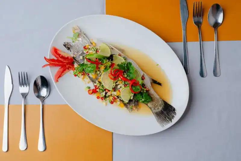 Whole steamed fish with lime, chilli and coriander