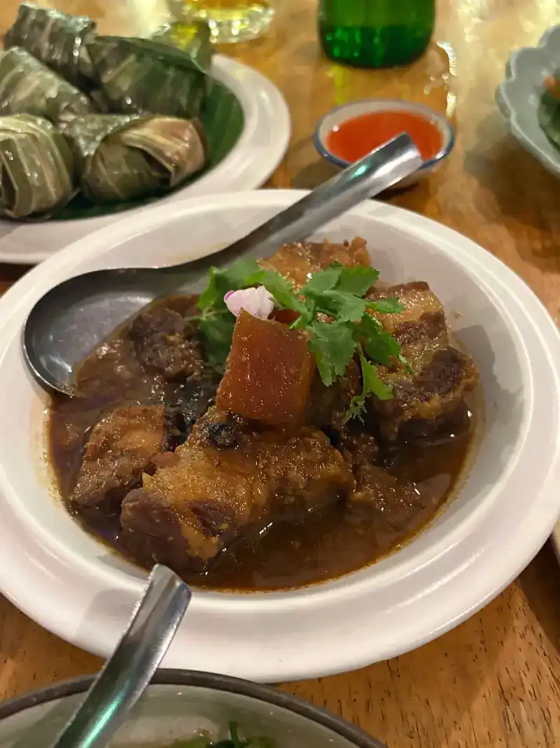 Braised pork belly topped with coriander