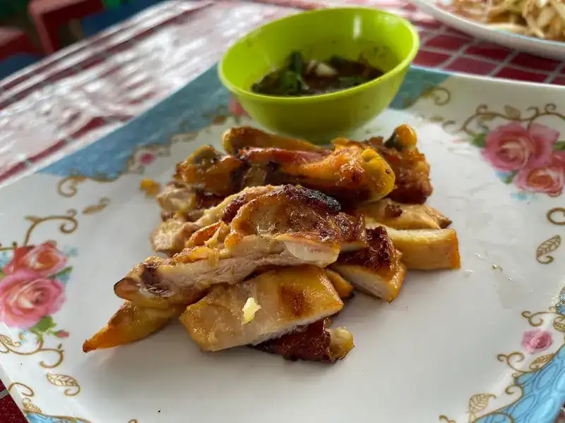 Grilled chicken, cut up, with a dipping sauce