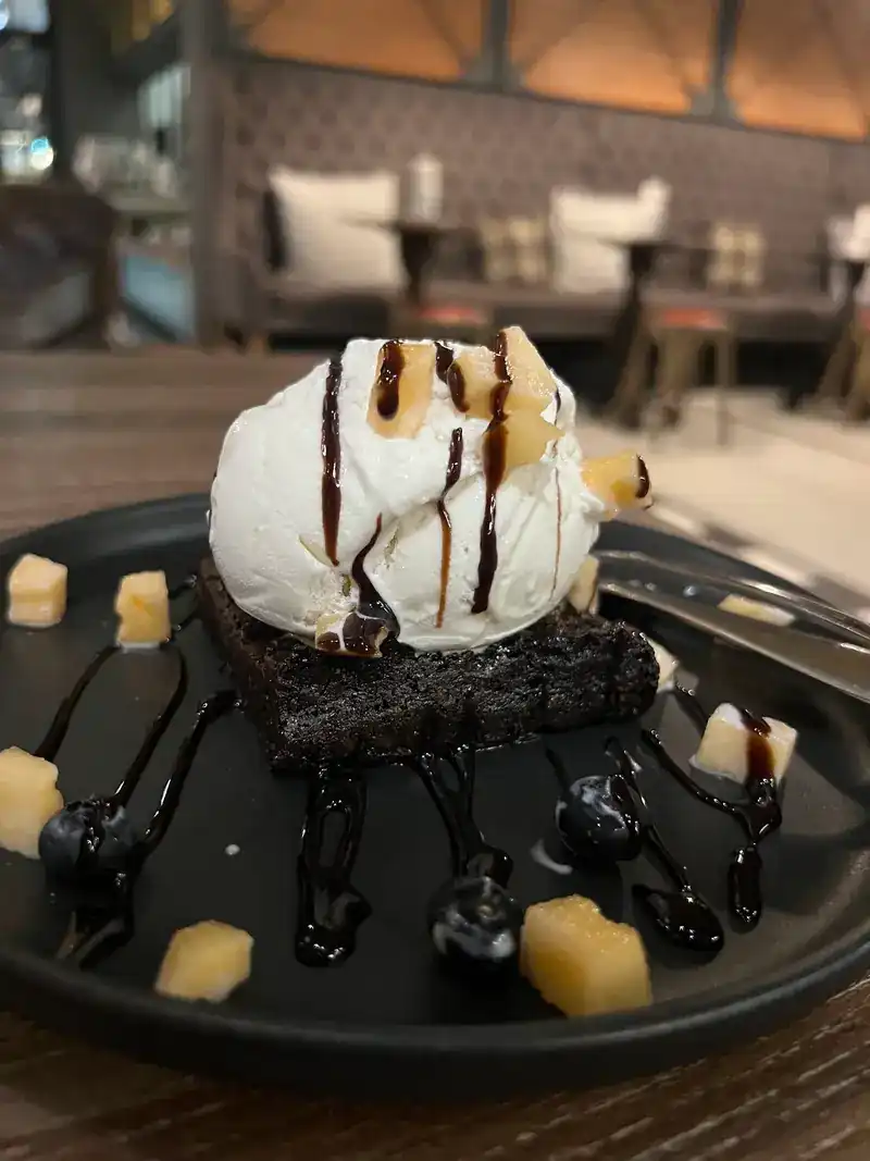 Chocolate cake with ice cream and chocolate sauce