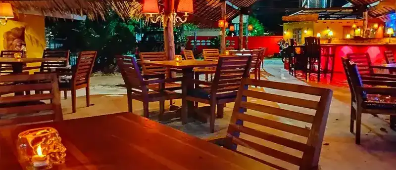 Outdoor tables at night at Sala Mexicali Phuket Town