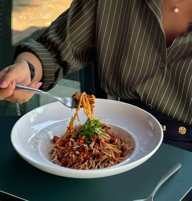 Spaghetti with a meat sauce, twirled on a fork
