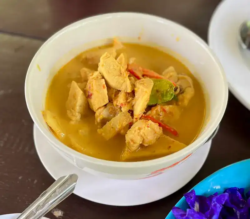 Chicken curry in a white bowl