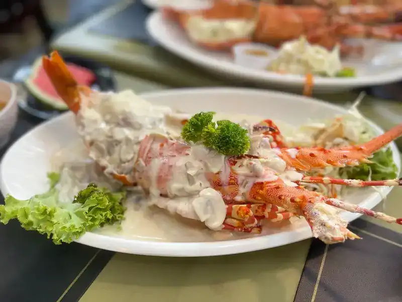 Lobster in a creamy sauce with parsley and lettuce