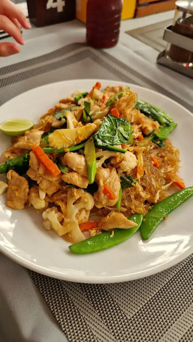 Stir-fried glass noodles with vegetables and snow peas