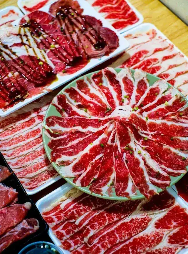 Plates of thinly sliced marbled beef for shabu