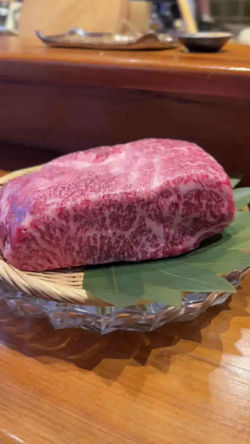 A block of marbled beef on a leaf