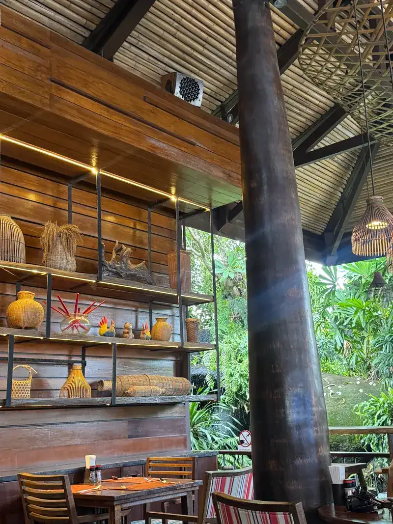 Tables by the open side of the room, looking out to the garden