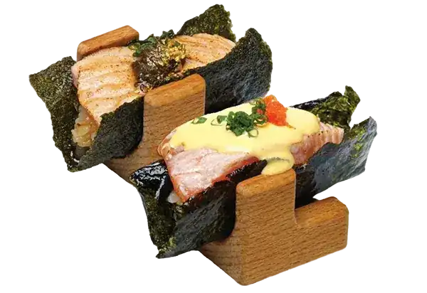 Two seaweed hand rolls on a wooden stand