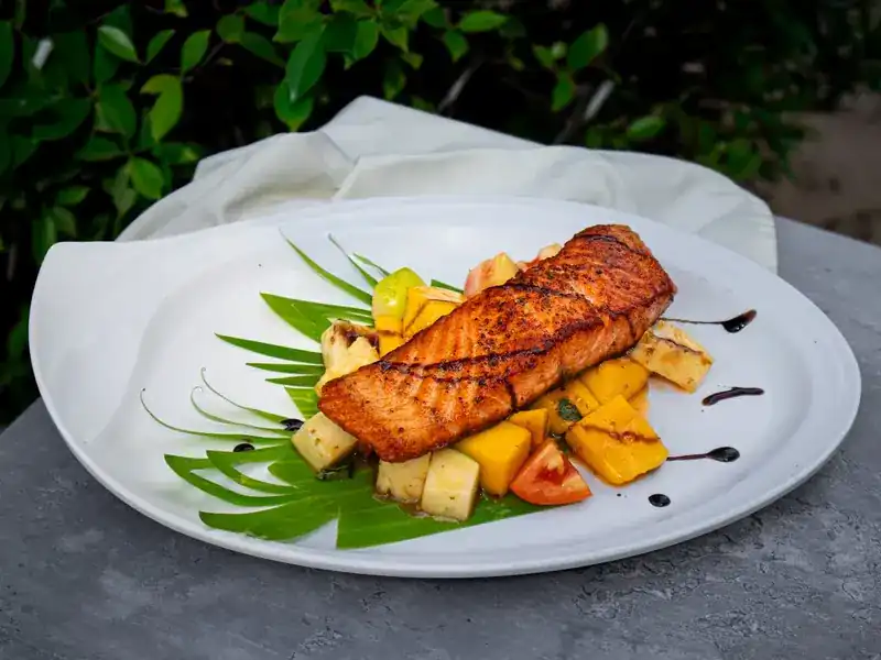 Seared salmon on pineapple and mango