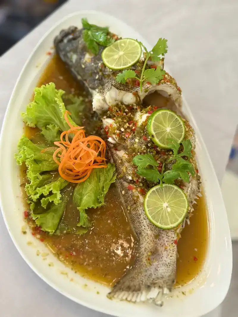 Whole steamed fish in a lime and chilli sauce