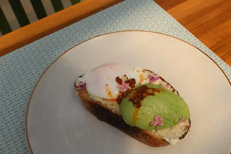 Avocado toast with a poached egg on sourdough
