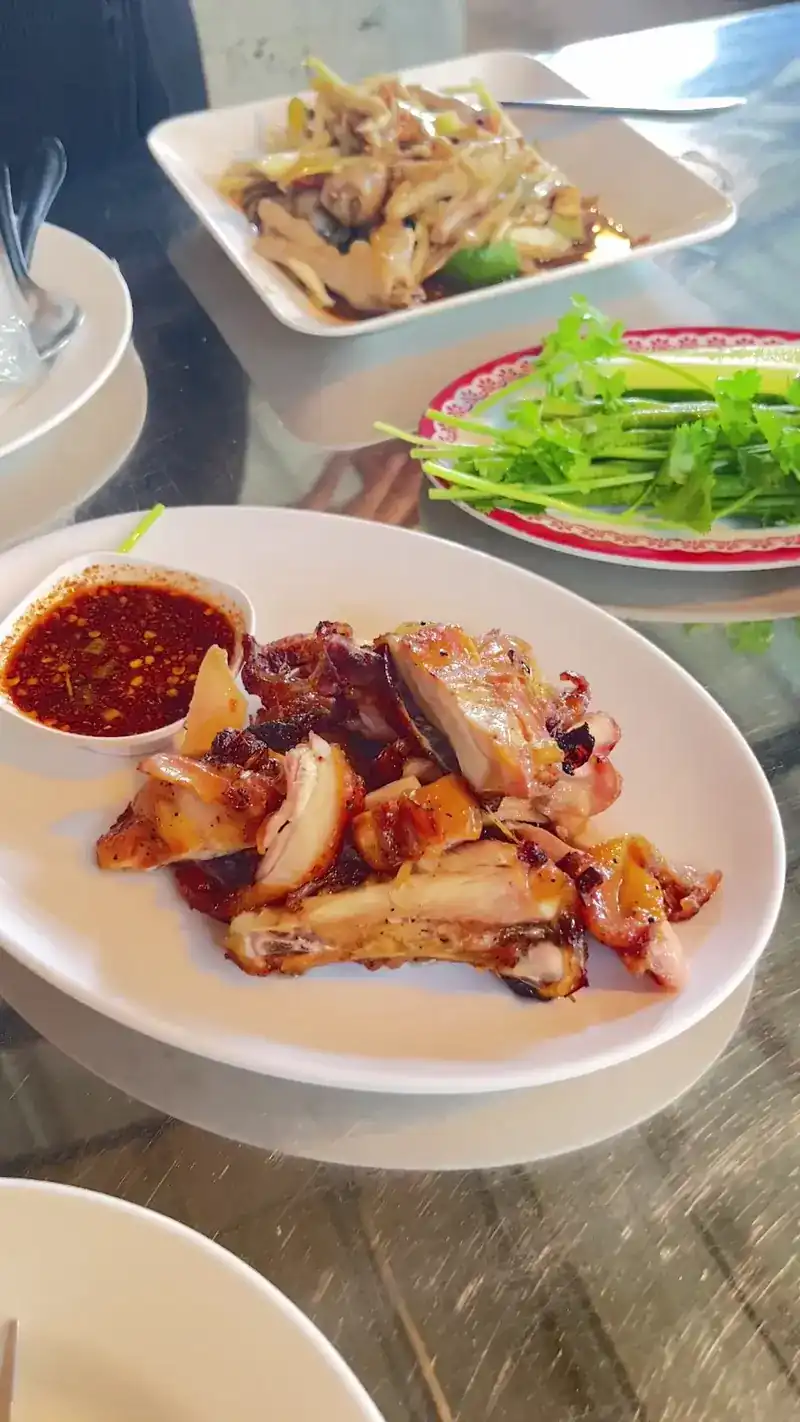 Grilled chicken with jaew and fresh herbs