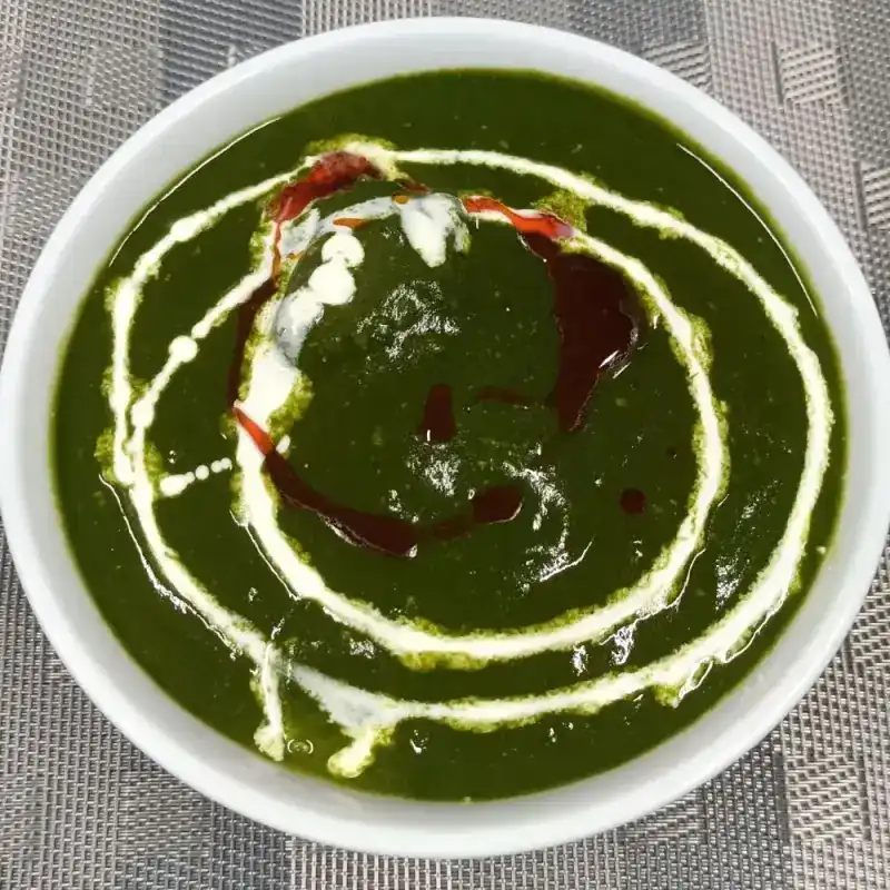 Spinach curry swirled with cream