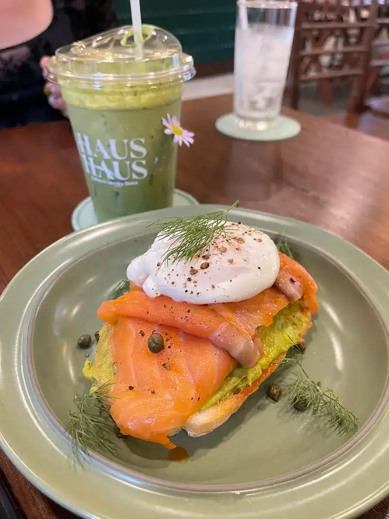 Smoked salmon and a poached egg on toast, with an iced matcha