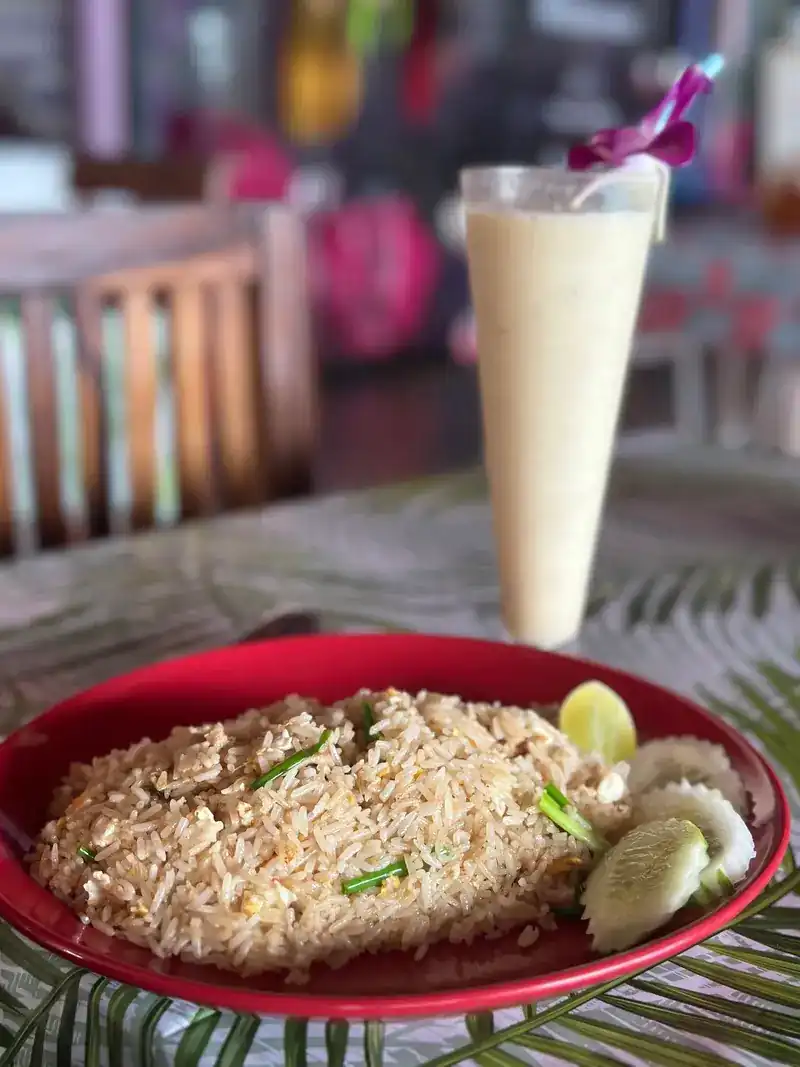 Fried rice with lime and cucumber, and a tall creamy drink