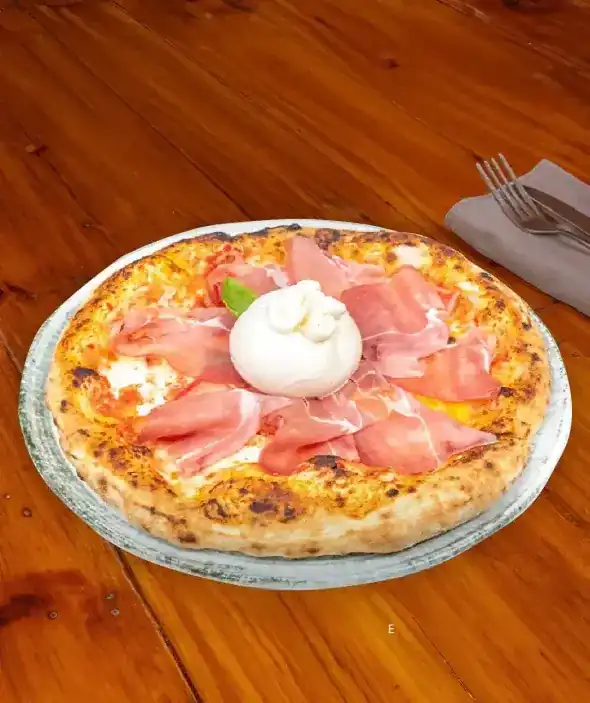 Pizza topped with cured ham and a whole burrata