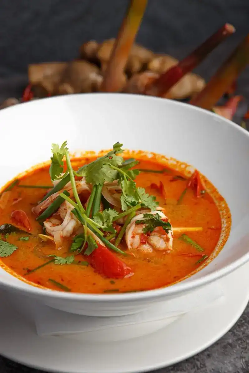 Tom yum soup with prawns, coriander and chili
