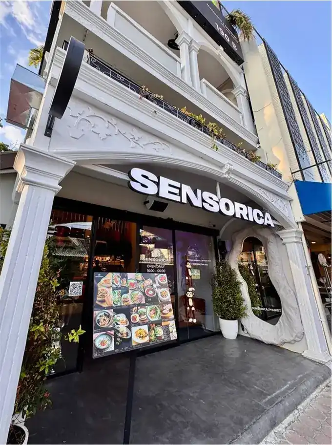 The white shopfront with the Sensorica sign over the door