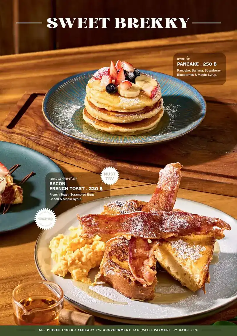 French toast under crisp bacon, dusted with sugar, with scrambled eggs