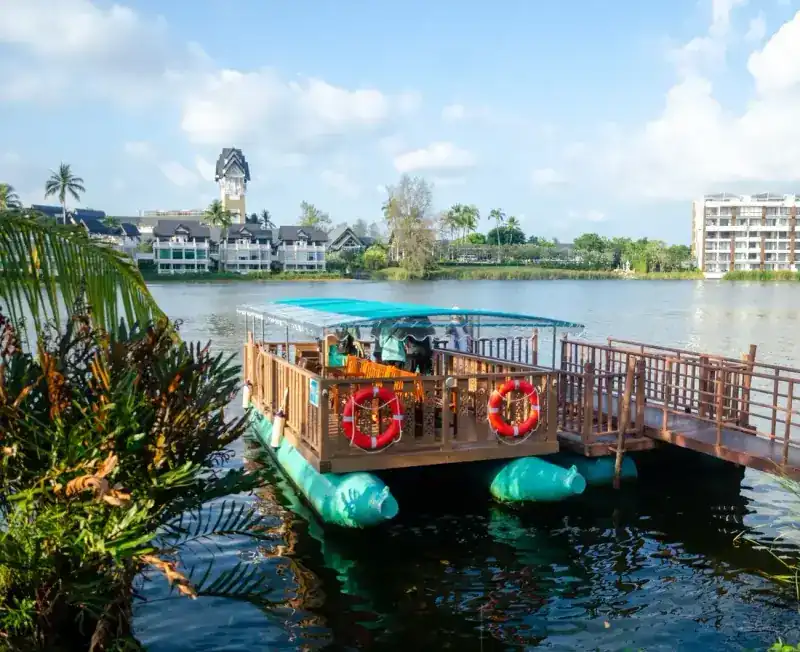 The Laguna ferry boat moored at a wooden jetty on the lake