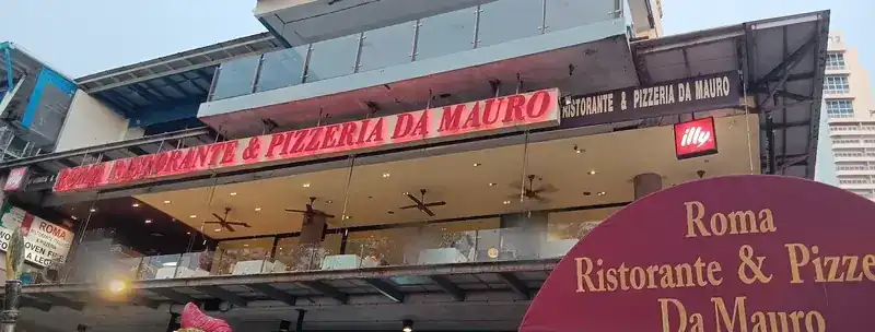 The front of the restaurant one floor up at Banana Walk, with its red letters and the burgundy awning