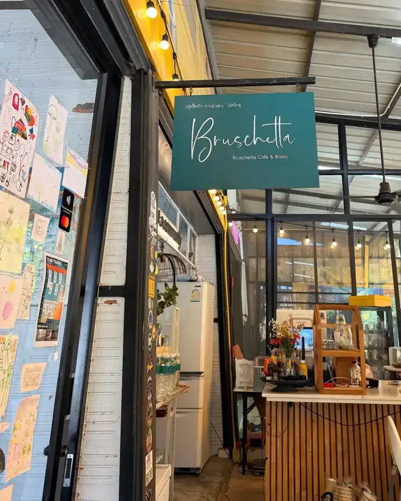 The teal Bruschetta sign over the entrance, with the counter behind it