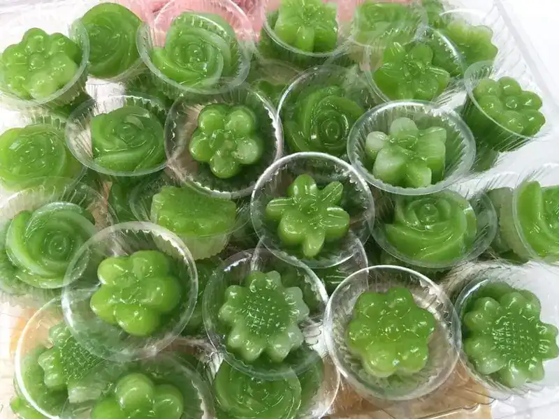 Green pandan jellies shaped like flowers in clear cups