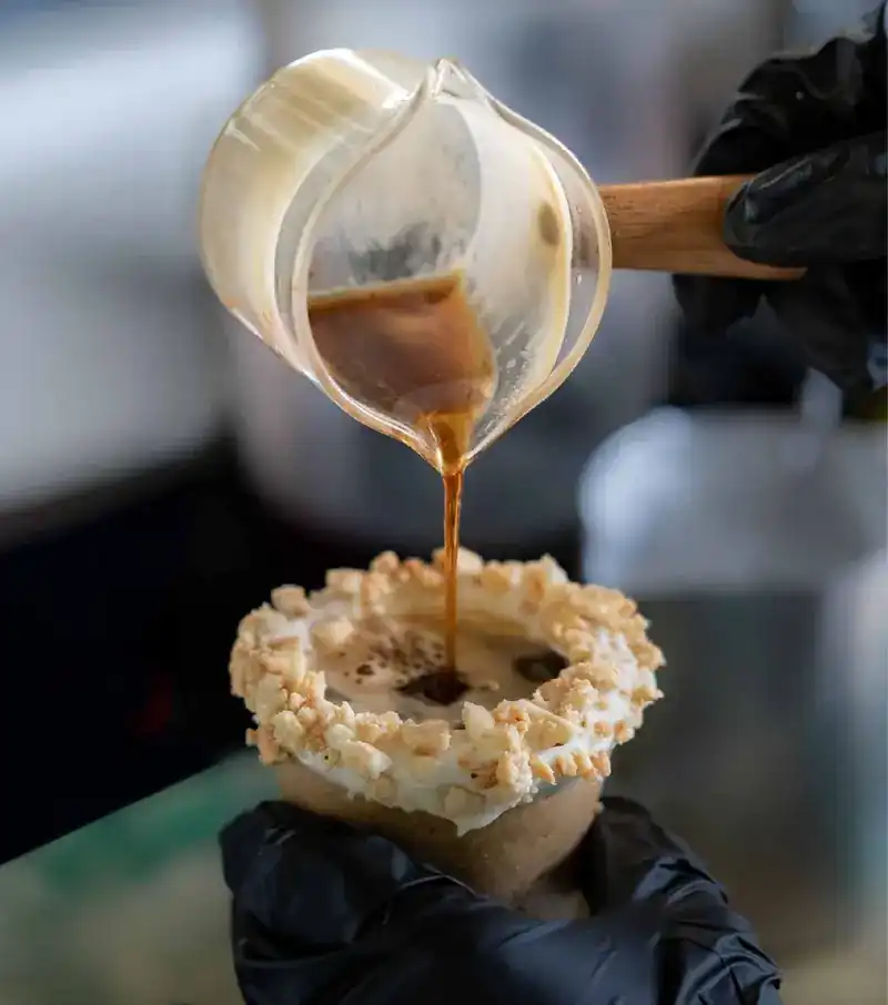 Espresso being poured into an edible cup