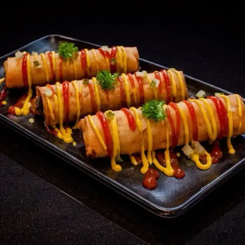 Cheeseburger Spring Rolls with ketchup and mustard