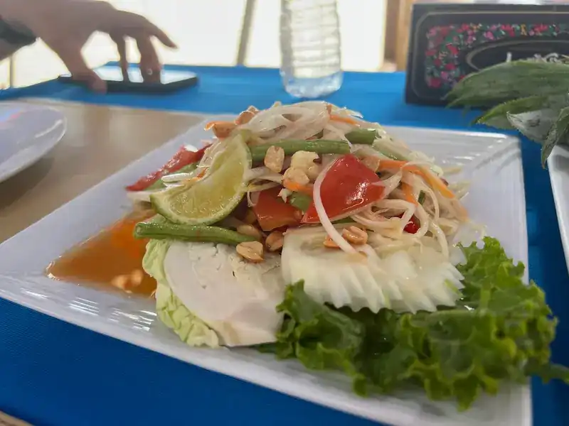 Green papaya salad with lime, long beans, tomato and peanuts