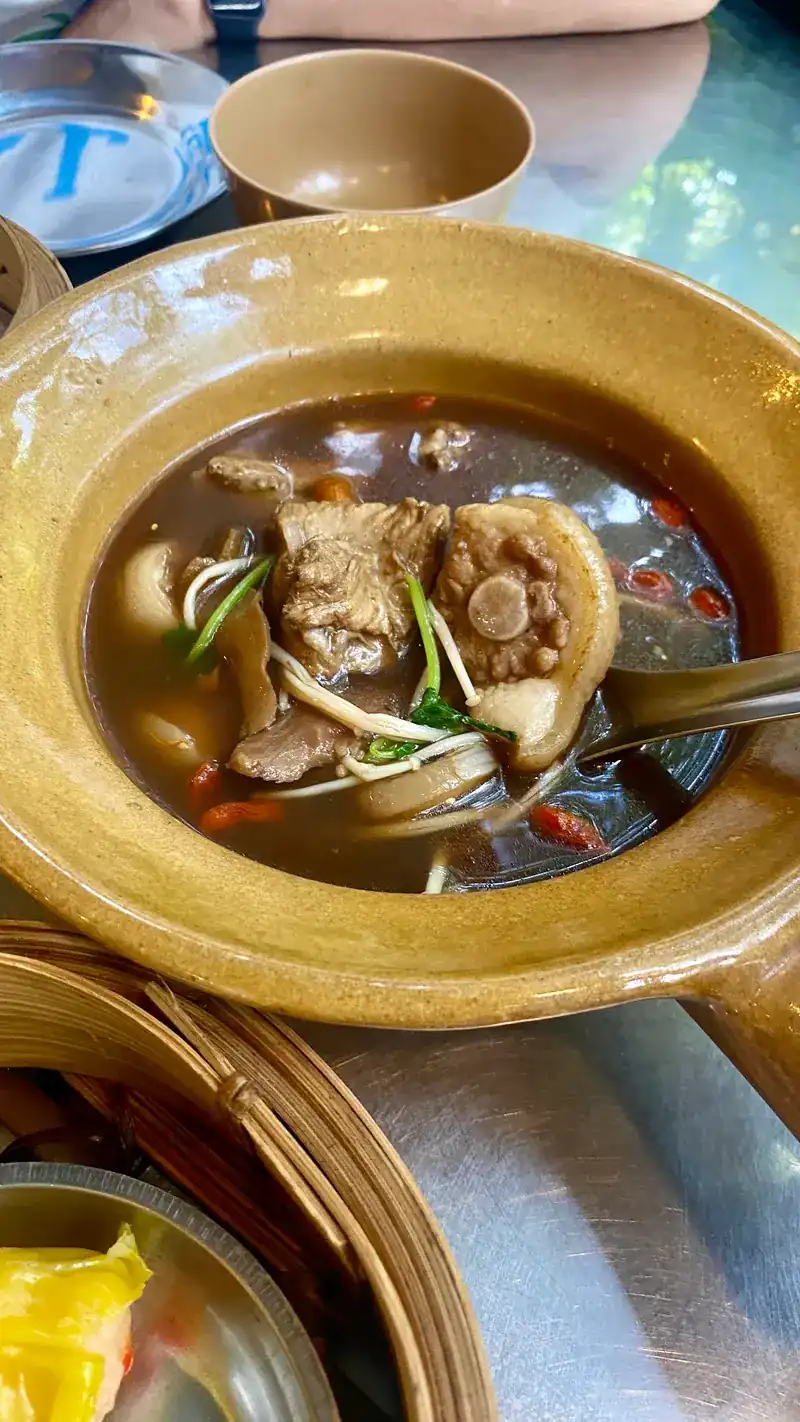 Bak kut teh, pork rib soup with mushrooms, in a glazed bowl