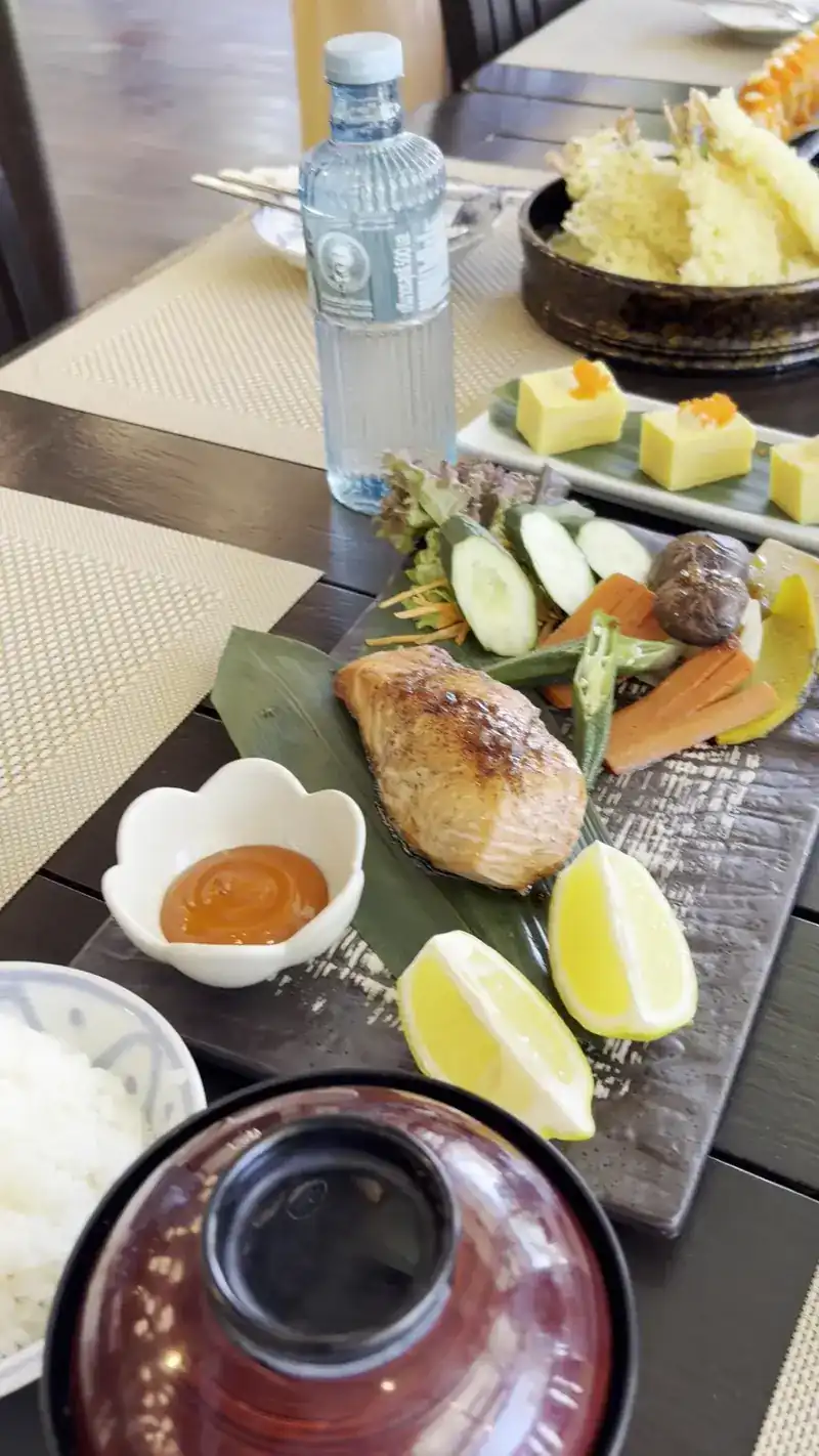 A grilled fish set with rice, miso soup, rolled omelette and tempura