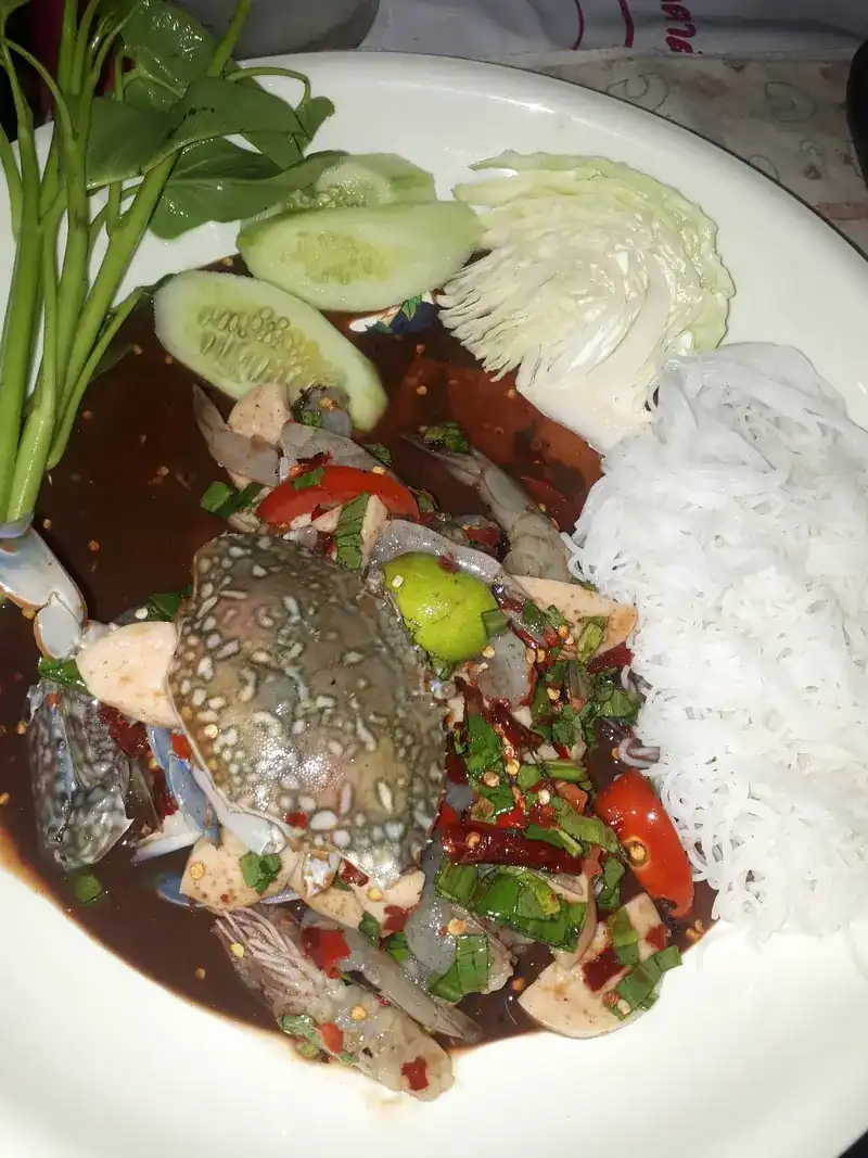 Blue crab papaya salad with rice noodles, cucumber, cabbage and morning glory