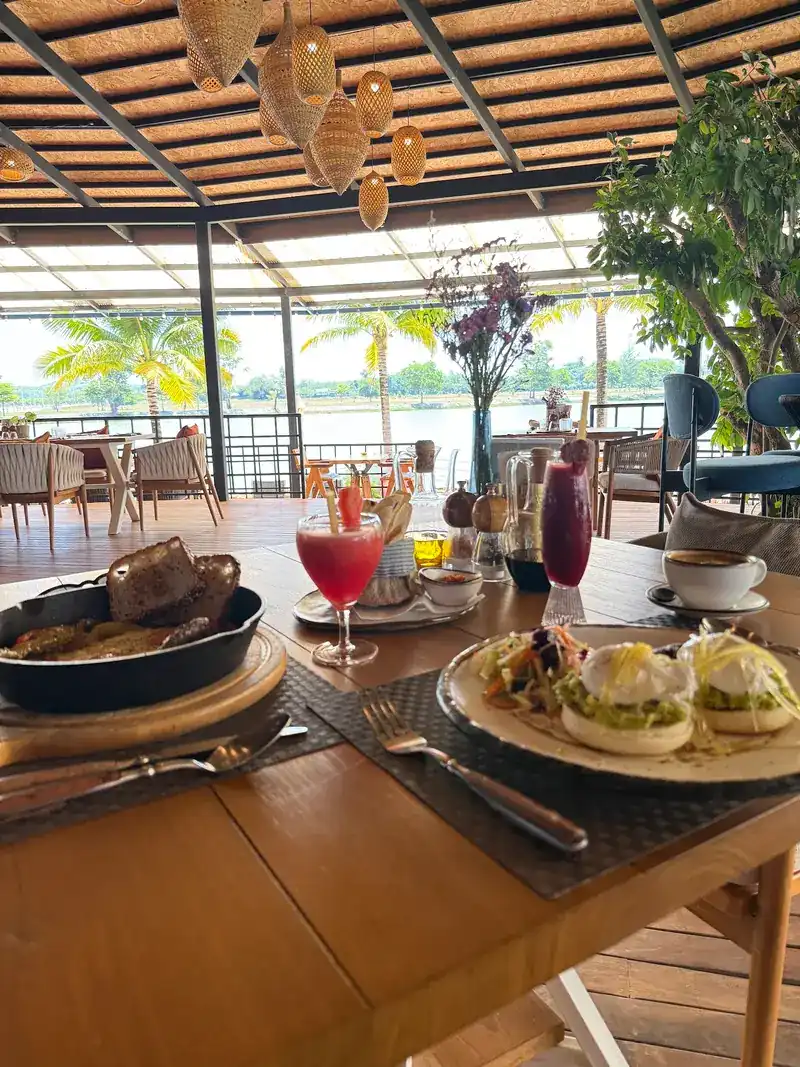 Breakfast and drinks at a table looking out to the lake