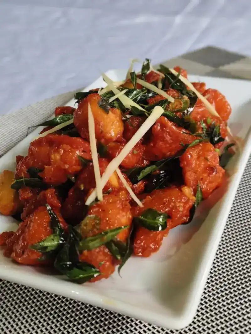 Crisp fried pieces in a red chilli glaze with curry leaves and ginger