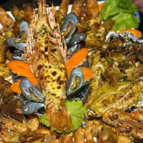 A seafood platter with lobster, mussels, prawns and grilled fish