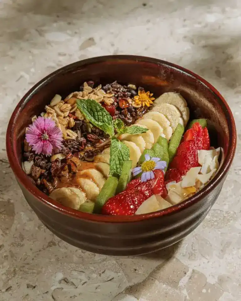 Açai bowl with granola, banana, strawberries and kiwi