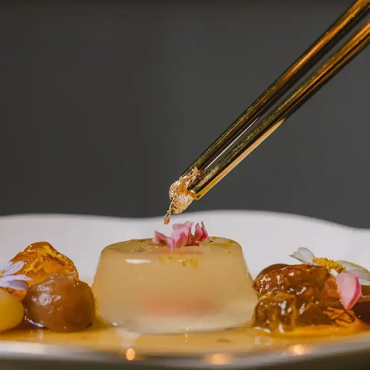 Gold leaf placed on a chilled dessert