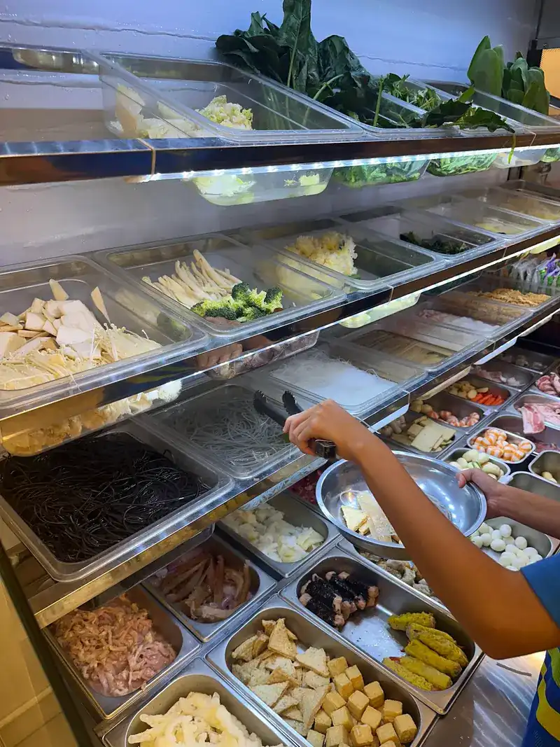 The chilled bar: trays of greens, tofu, noodles and fish balls