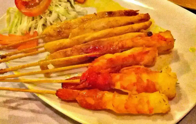Skewers from the grill, served with salad