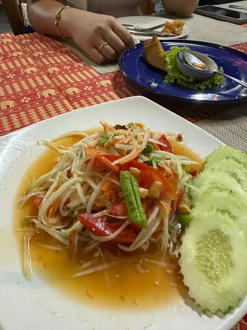 Green papaya salad with tomato, long beans and cucumber