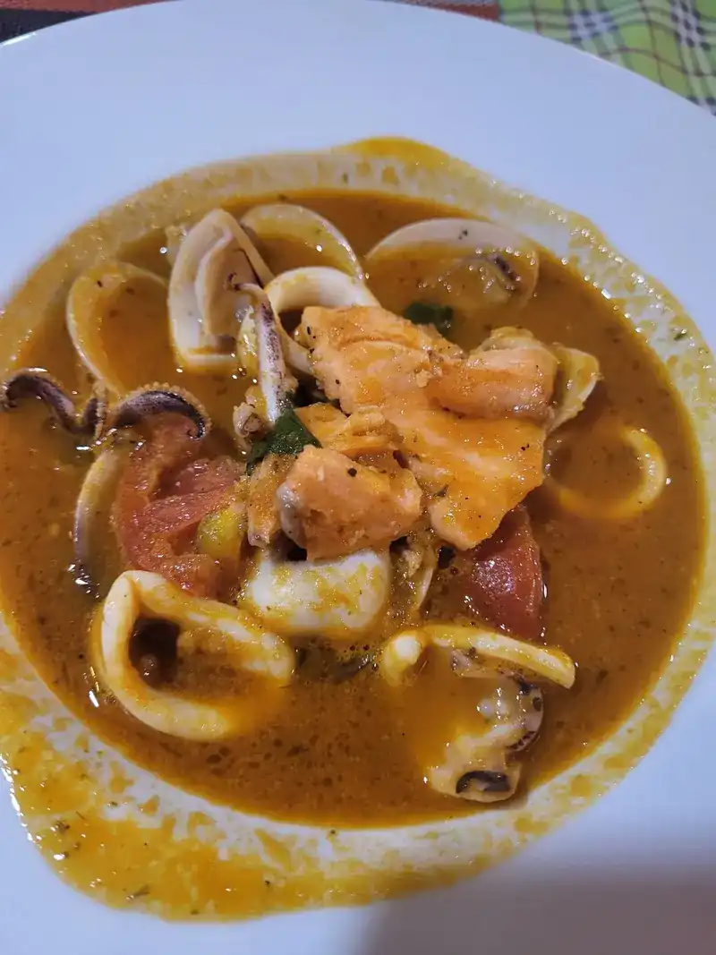 Squid, clams and fish in a tomato broth