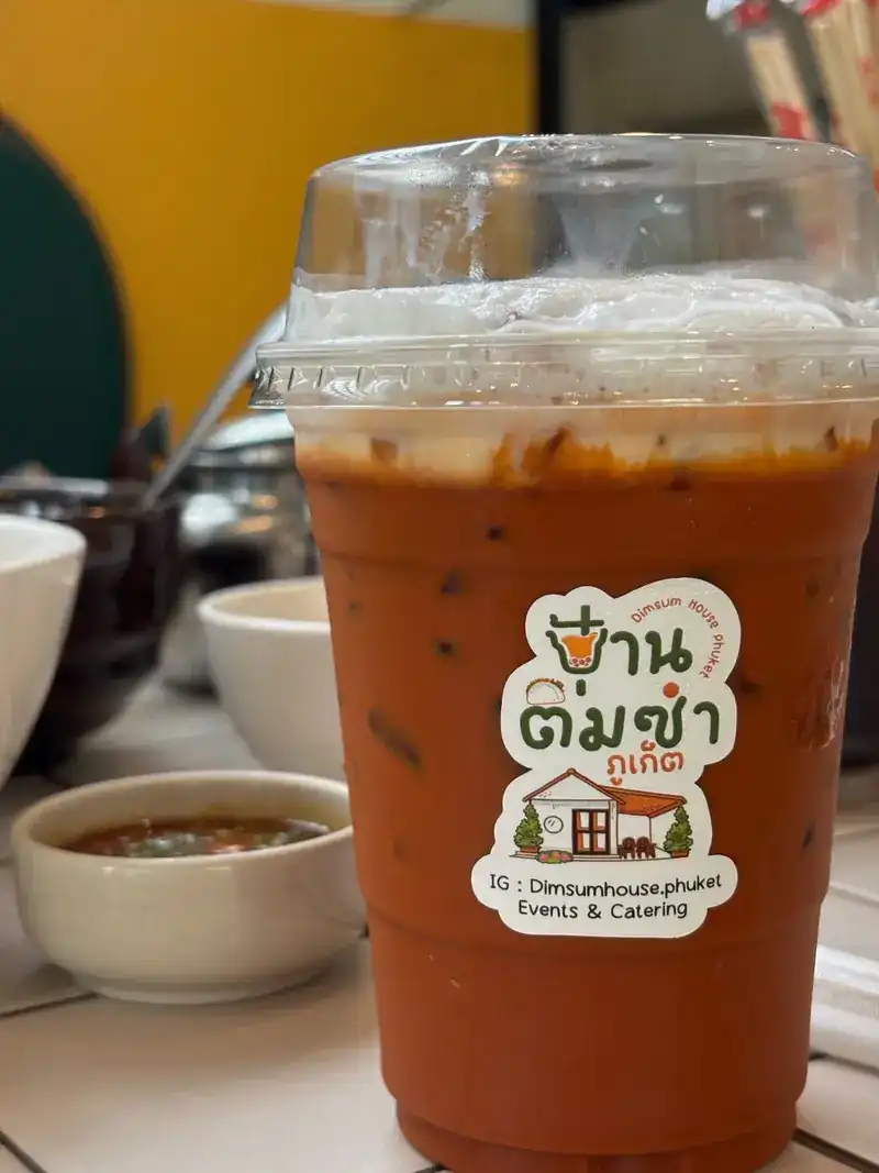 Thai iced tea in a cup with the house's own sticker
