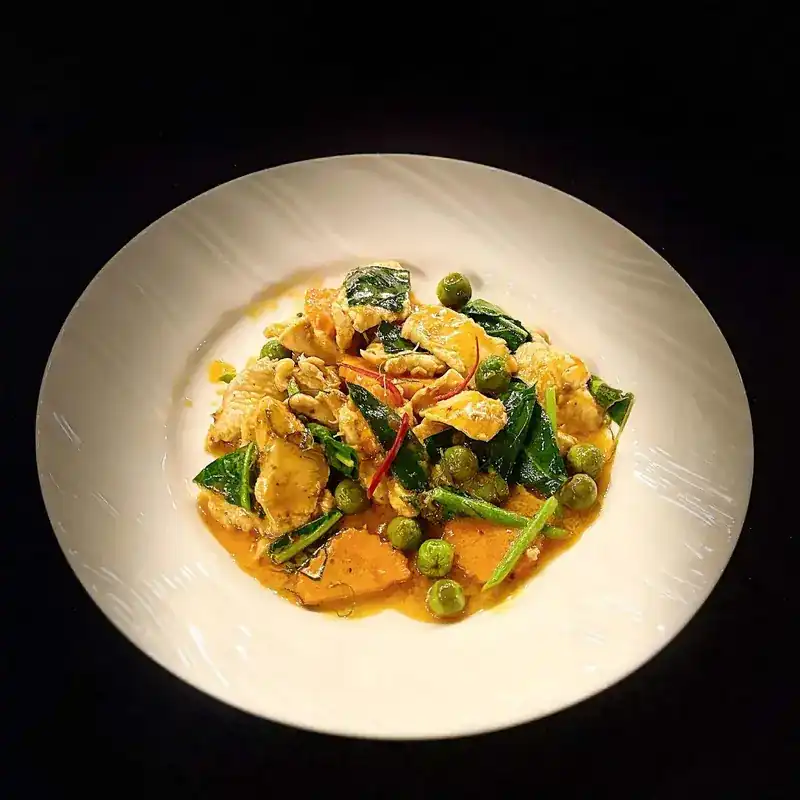 A Thai curry with pea aubergines and red chilli