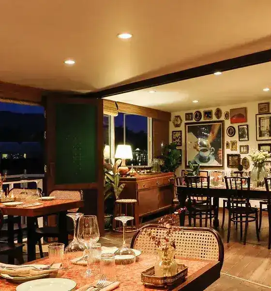 The private room in the evening, with lamps and framed pictures