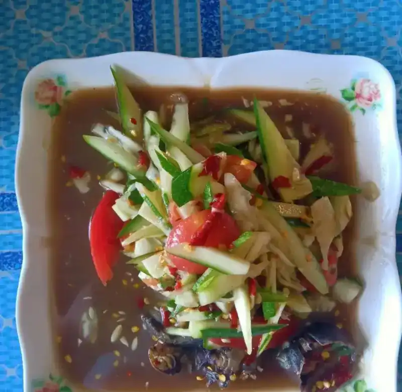 Red papaya salad with salted crab and pla ra